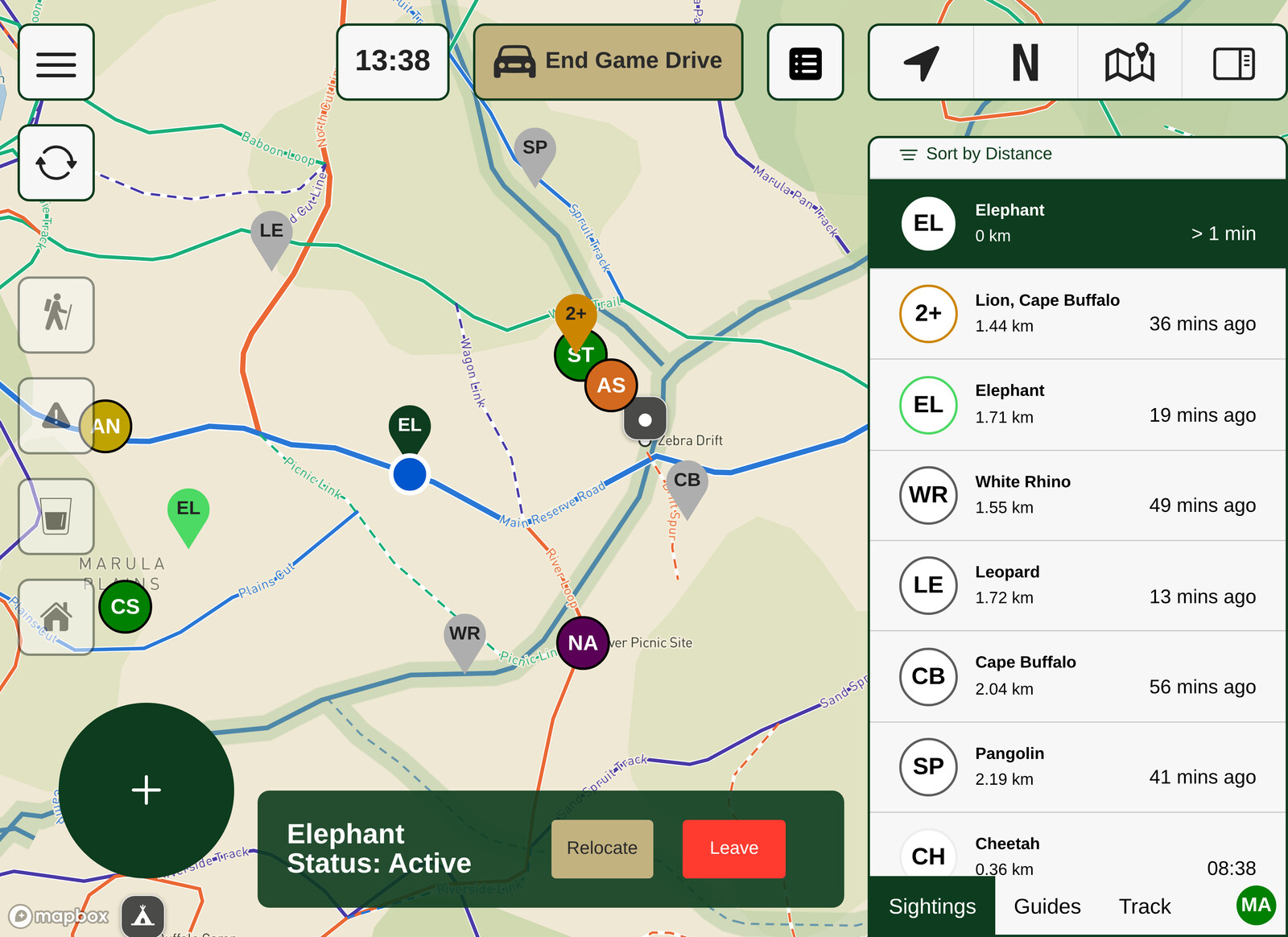 The WildSight map on a guide's tablet, showing named reserve roads, tracks and waterholes, colour-coded pins for elephant, lion, white rhino, leopard, cheetah and pangolin sightings, and a list beside the map ranking each sighting by distance and how long ago it was reported.