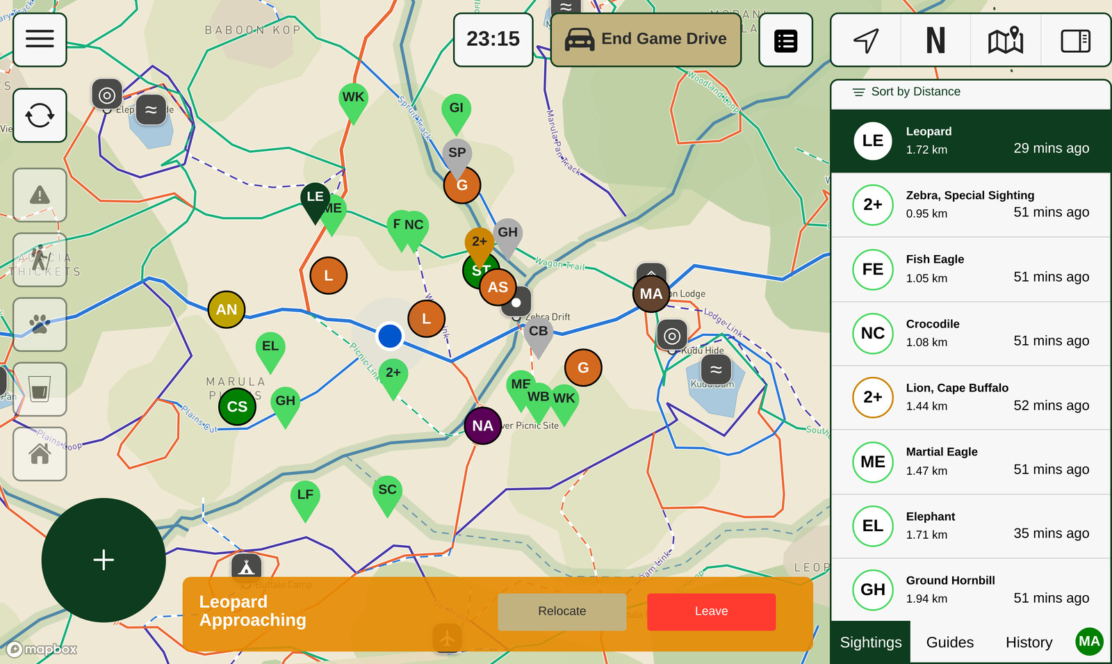 The WildSight map during a drive: colour-coded sighting pins for leopard, lion, elephant, giraffe and more across the named reserve, a distance-sorted sighting list on the right, and an alert reading "Leopard Approaching".